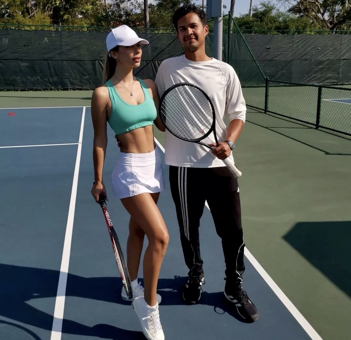 Pablo coaching a student on a South Florida court